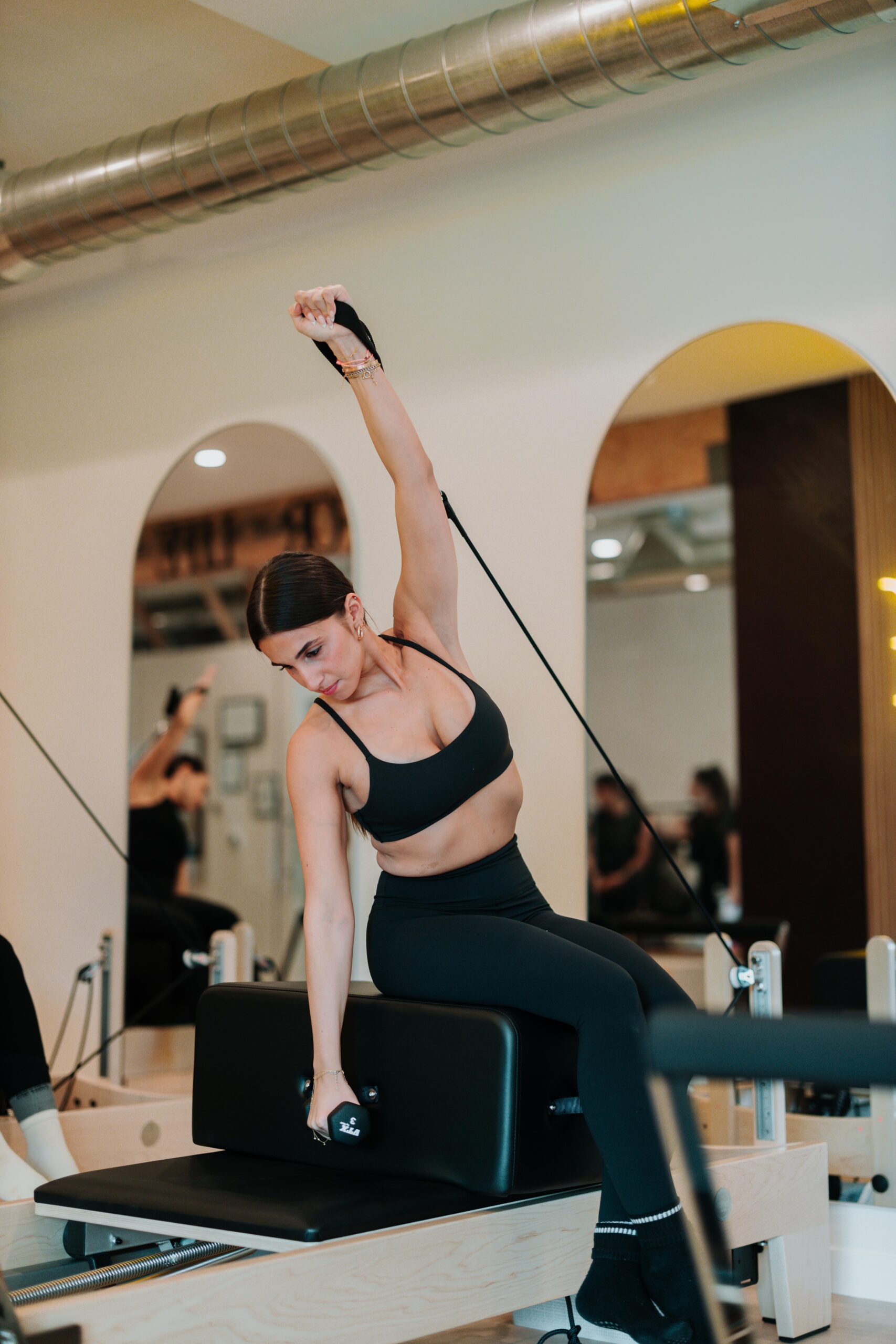 Reformer Pilates class in session at YA FIT Pilates