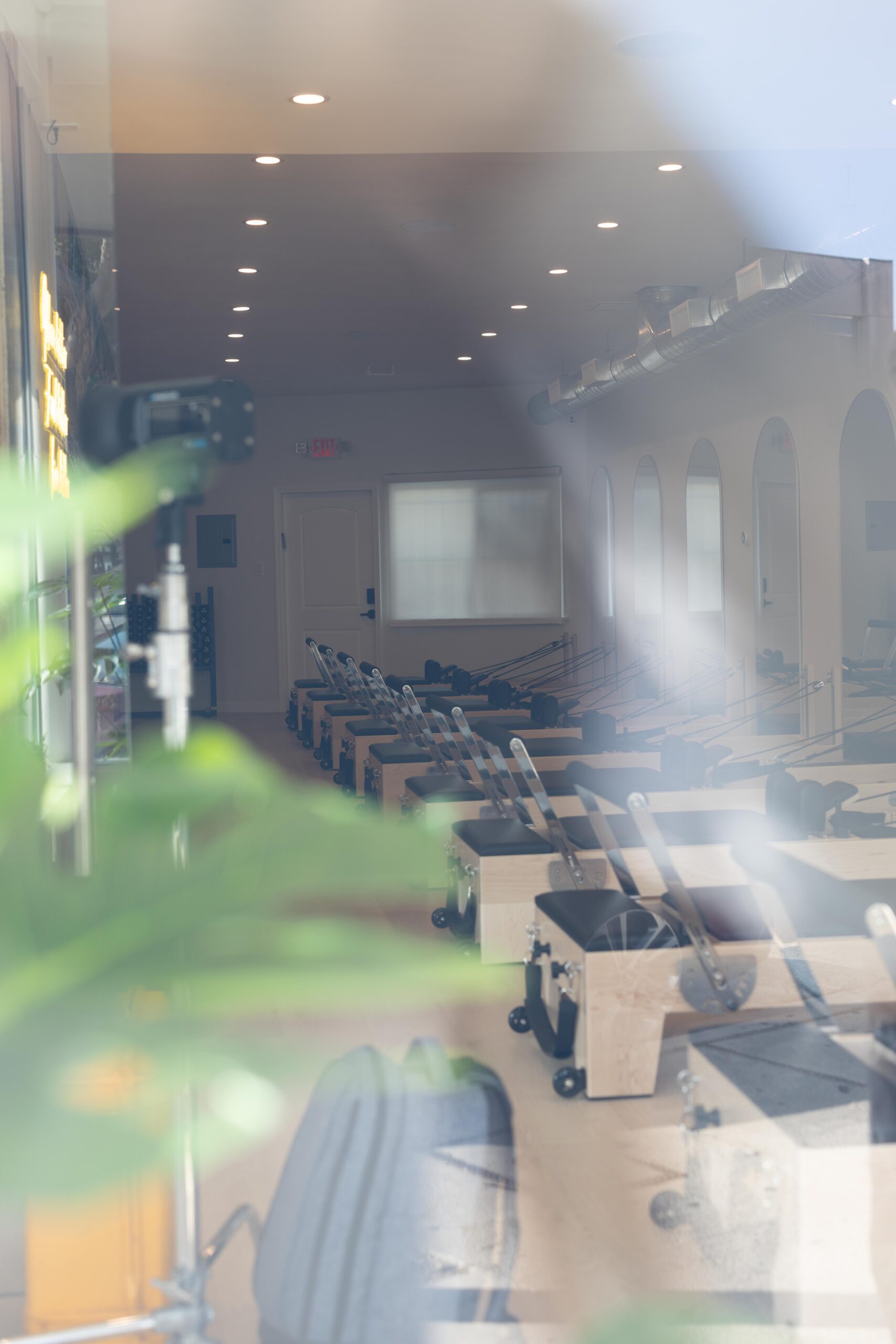 Pilates reformers lined up at YA FIT Pilates Tarzana boutique studio